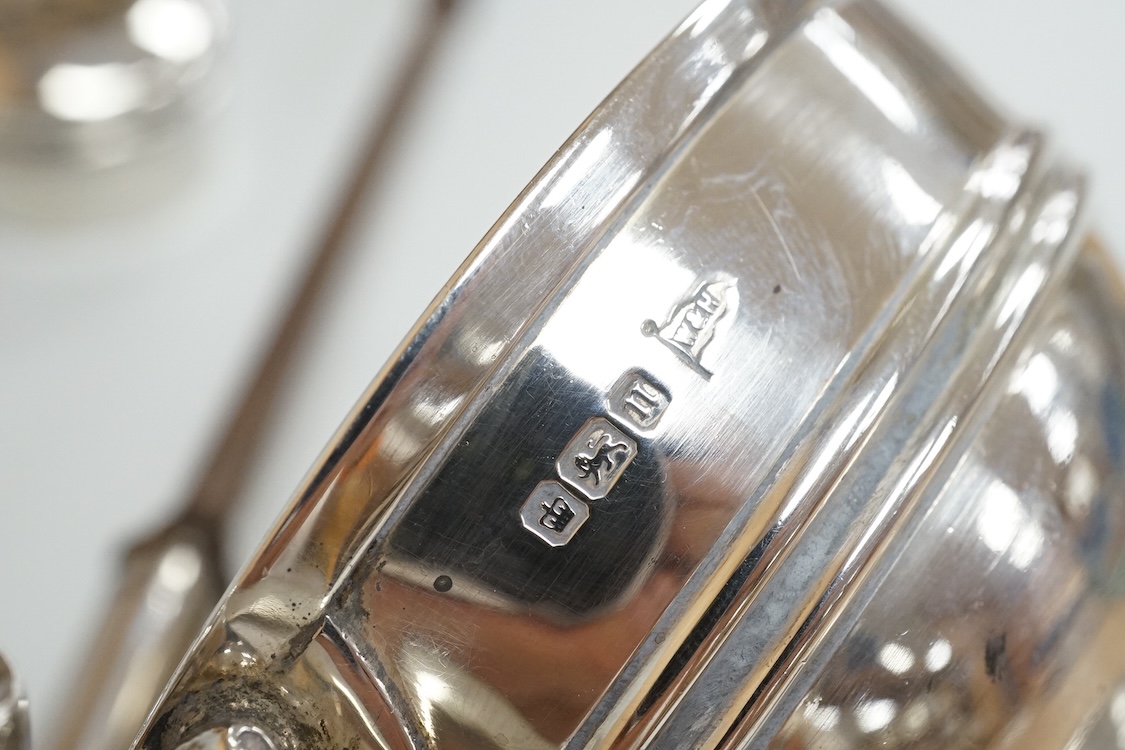 A George V silver mounted capstan inkwell, A & J Zimmerman Ltd, Birmingham, 1913, diameter 11.4cm, together with a small silver bowl, a small silver 'dish ring' salt(a.f.), a silver two handled bowl, a silver pill box an